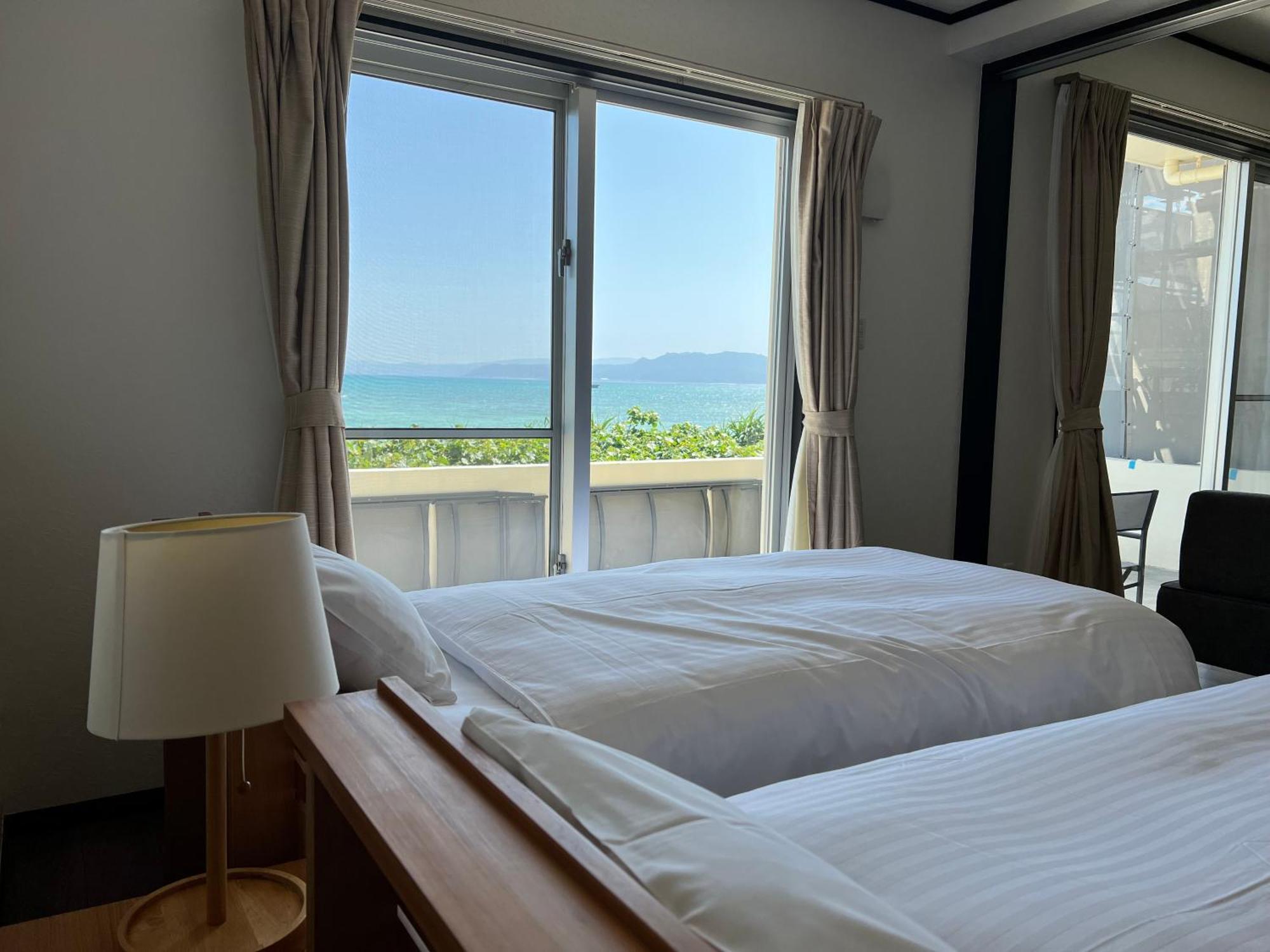 Ocean Front Sumuide Apartment Nago Bagian luar foto
