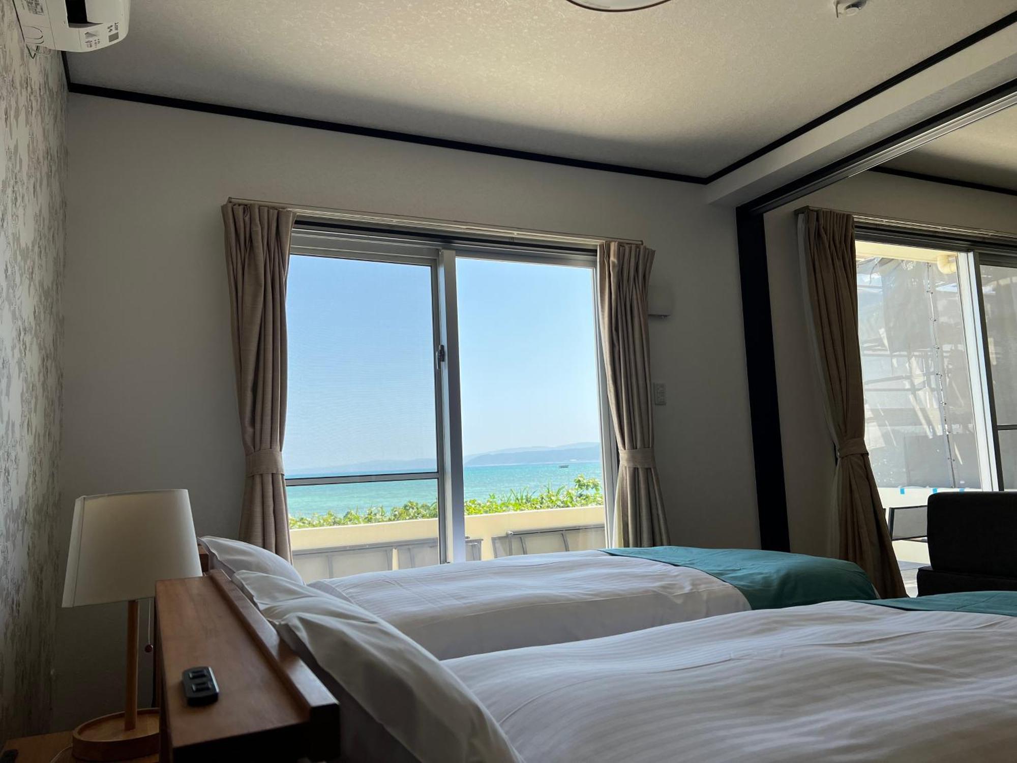 Ocean Front Sumuide Apartment Nago Bagian luar foto